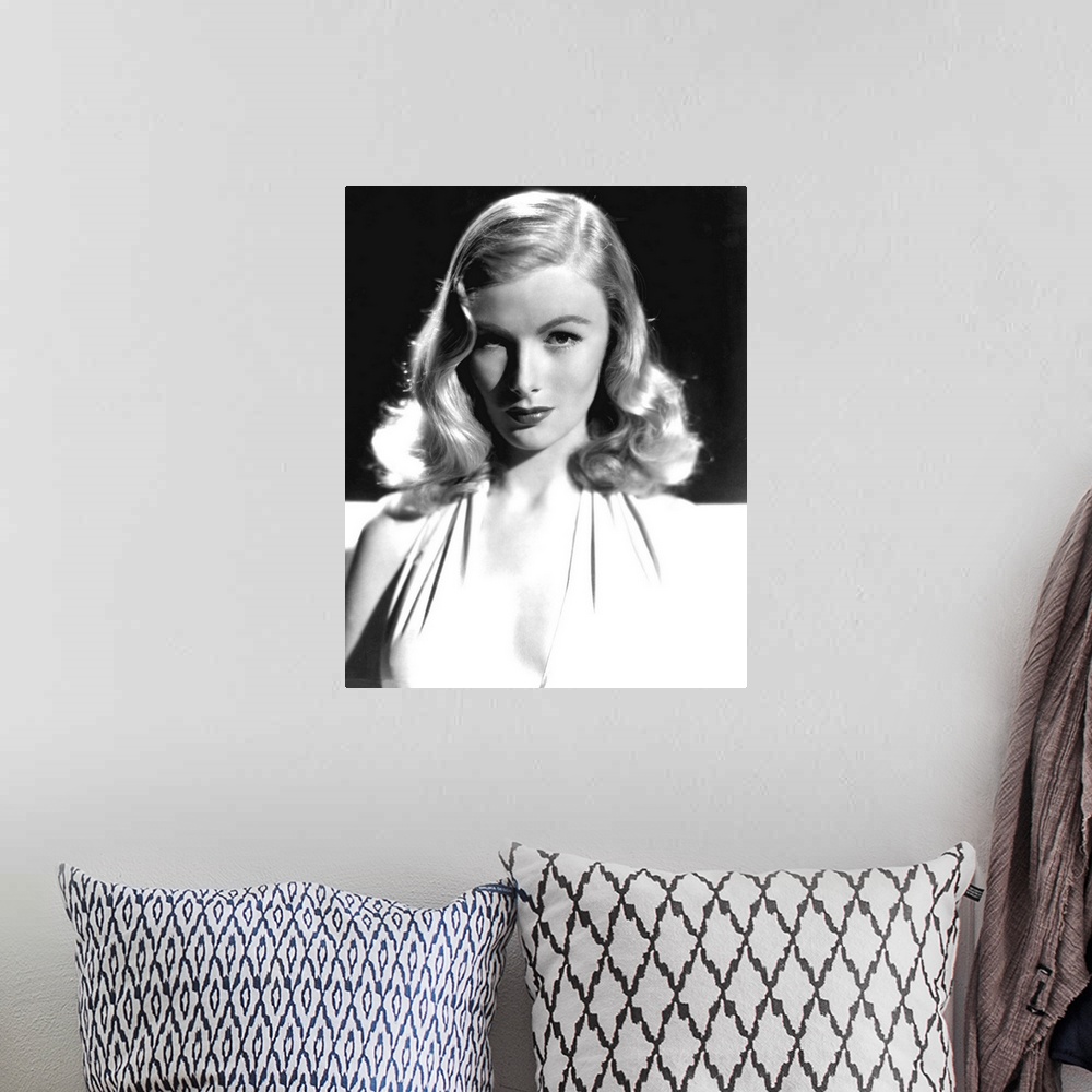 A bohemian room featuring Vintage black and white photograph of actress Veronica Lake.