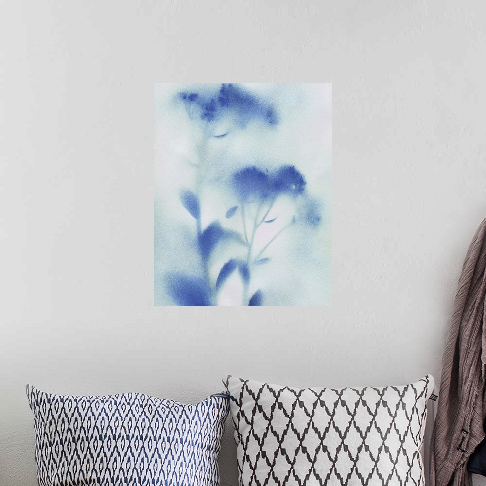 A bohemian room featuring Abstract painting of wildflowers with a misty look in blue and white.