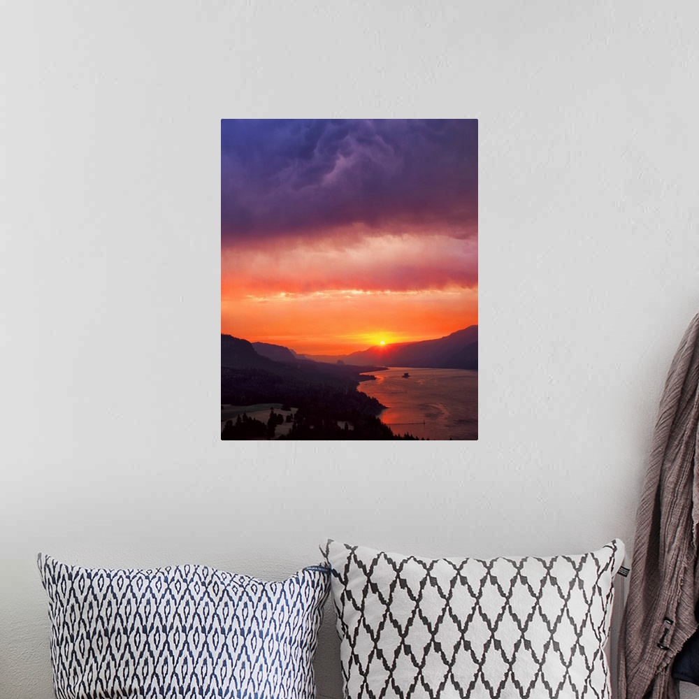 A bohemian room featuring Fiery sunset with a cloudy sky over the Columbia River Gorge.