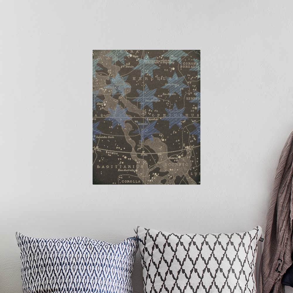 A bohemian room featuring Mixed media artwork with a star map and geometric painted shapes.