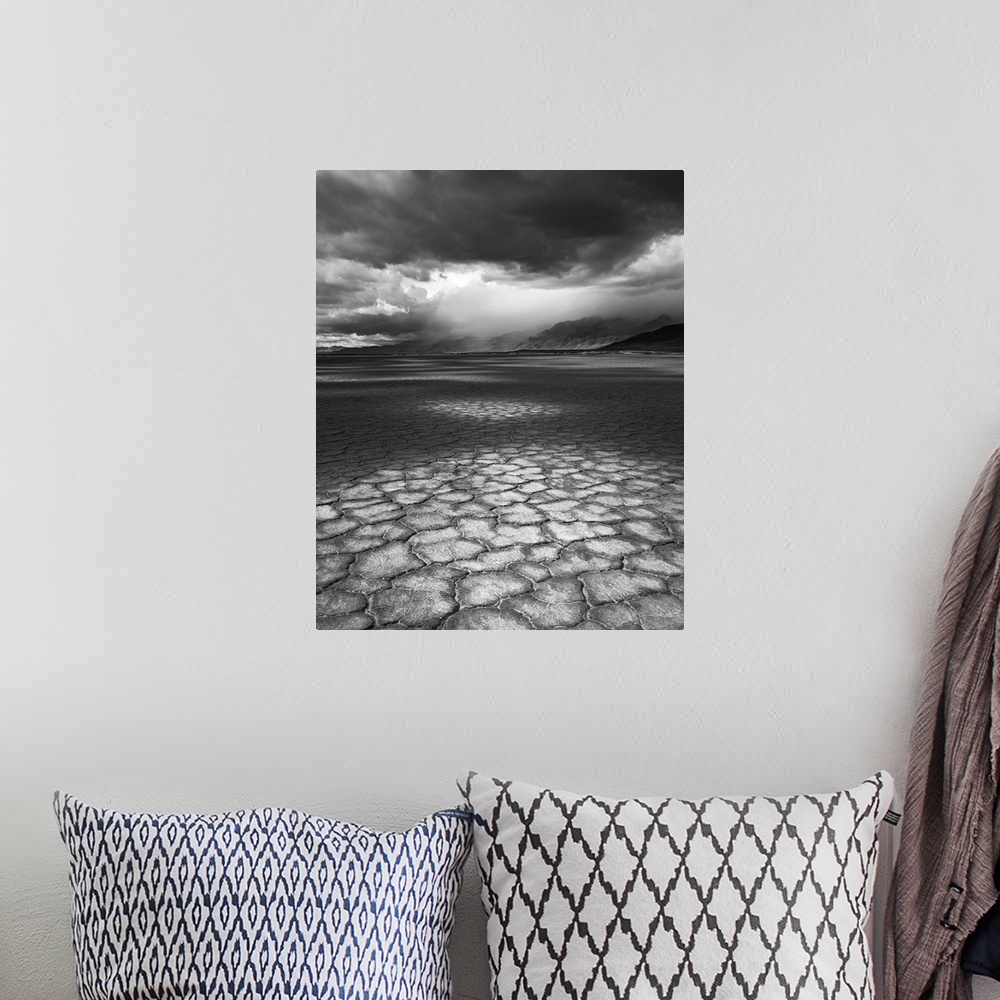 A bohemian room featuring A rainstorm travels over Steens Mountain as seen from the Alvord Desert in Oregon.