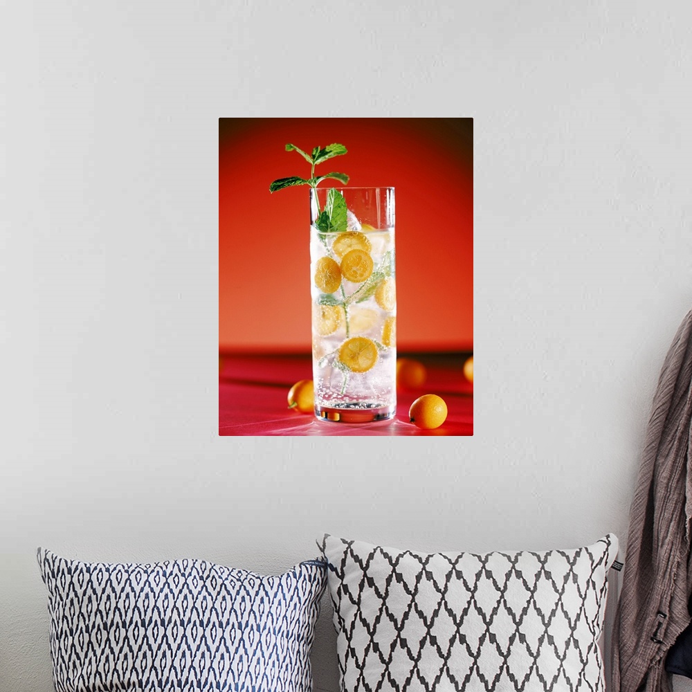 A bohemian room featuring Cocktail with lemon slices and mint leaf, close-up