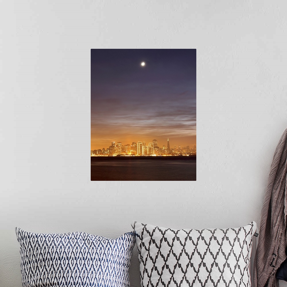 A bohemian room featuring Moon setting over San Francisco on hazy December evening, taken from Treasure Island.