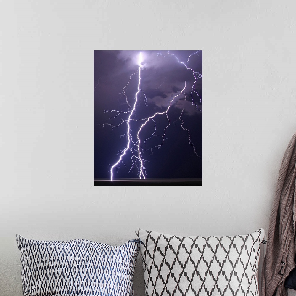 A bohemian room featuring Multiple cloud to ground lightning strikes fill frame on this shot of summer night's storm over p...