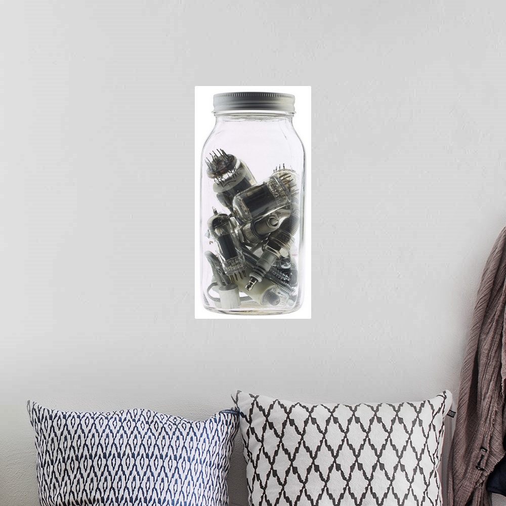 A bohemian room featuring old-fashioned jar with spark plugs