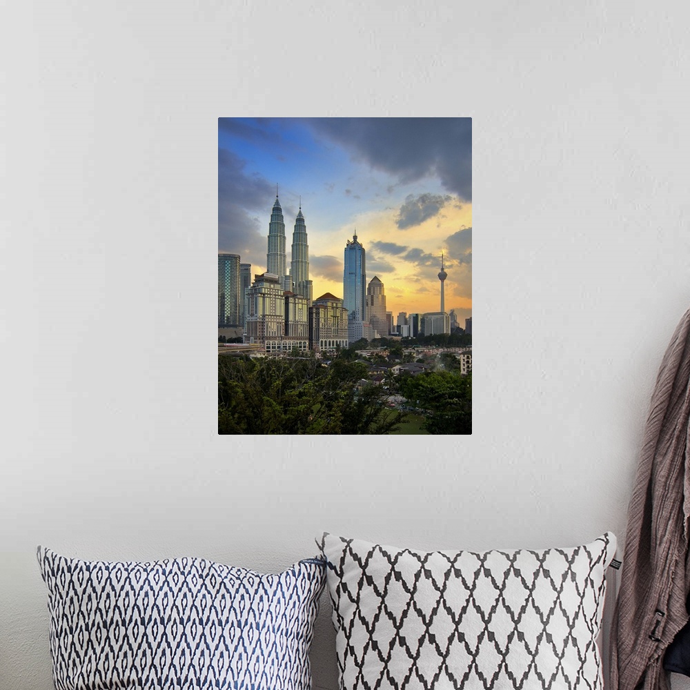 A bohemian room featuring Petronas twin towers at sunset.