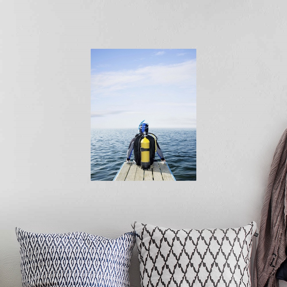 A bohemian room featuring Scuba diver looking out to sea