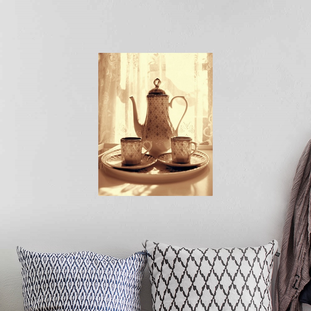 A bohemian room featuring Still life of teapot and cups on tray by window