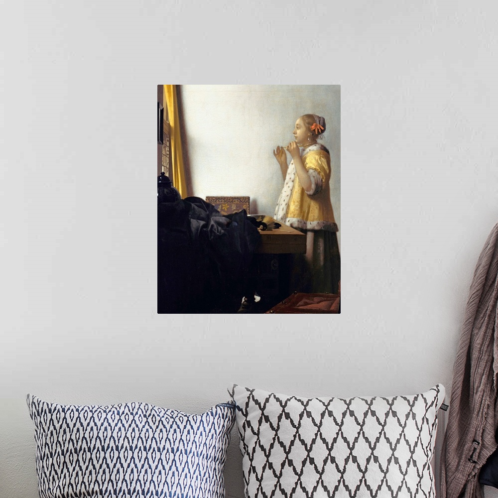 A bohemian room featuring Jan Vermeer (Dutch, 1632?1675), Young Woman with a Pearl Necklace, circa 1662. Oil on canvas, 45 ...