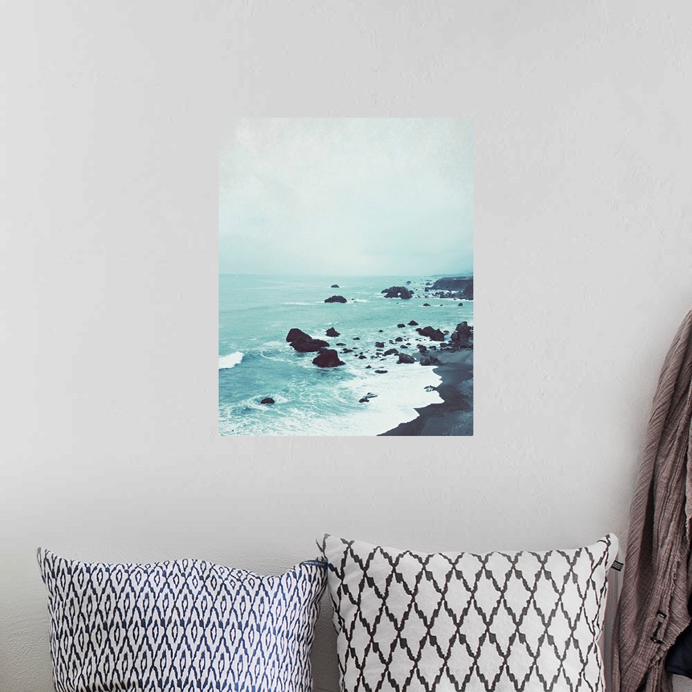 A bohemian room featuring Photography of a peaceful rock beach at dusk.