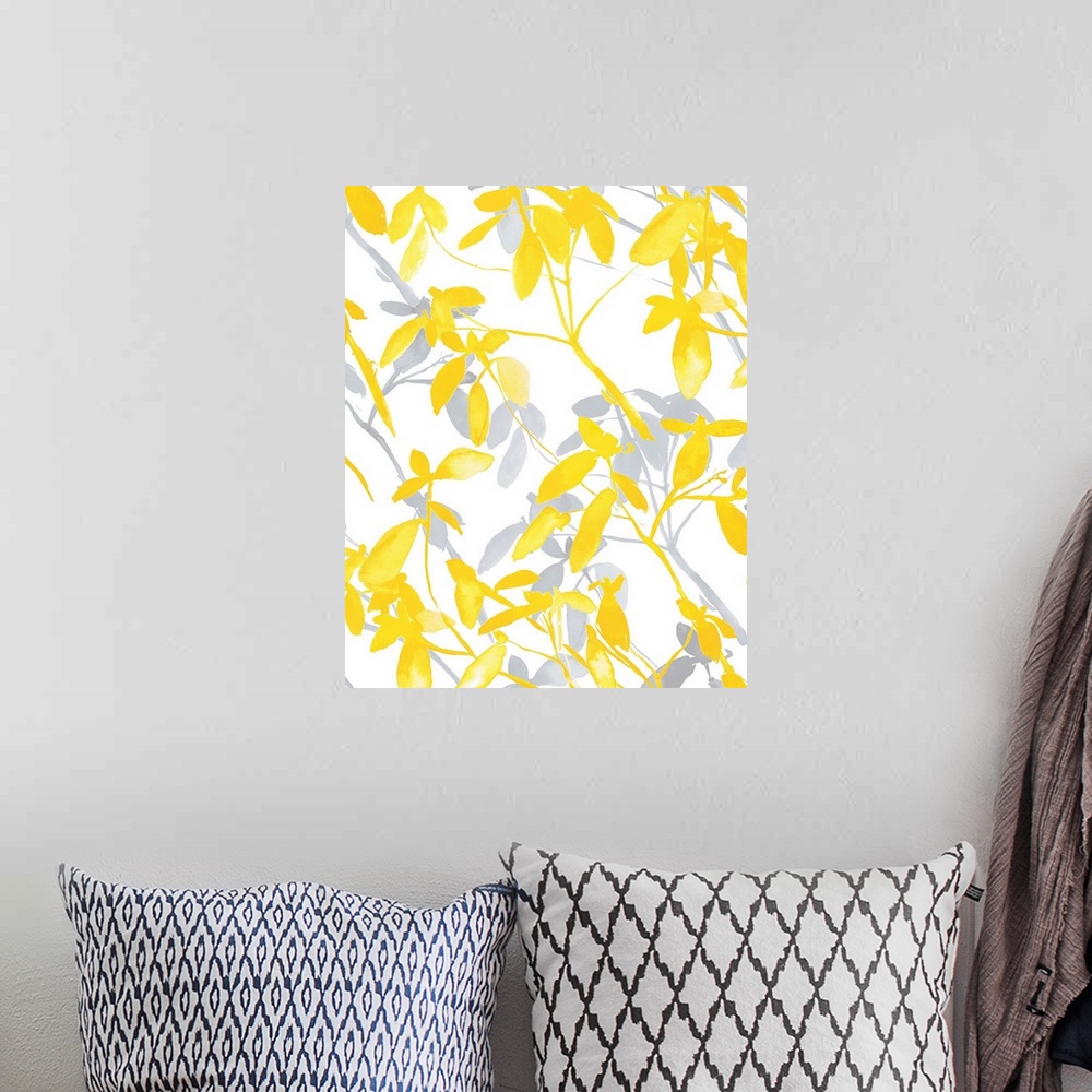 A bohemian room featuring An abstract watercolor painting of branches of leaves in colors of yellow and gray.