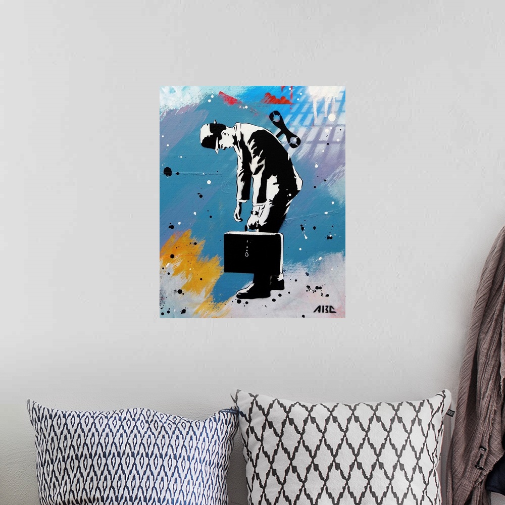 A bohemian room featuring Urban painting of a business man with a wind-up key in his back.