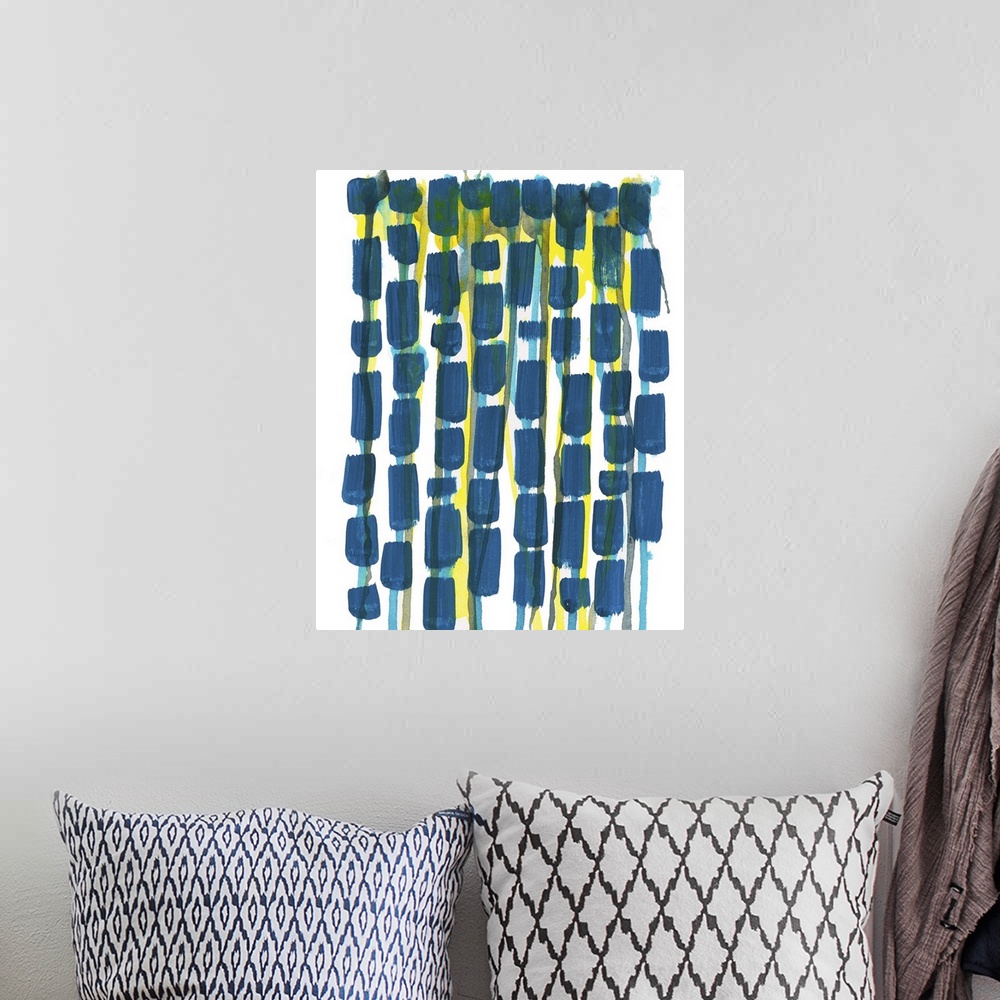 A bohemian room featuring Contemporary artwork featuring a chain of navy blue shapes with yellow areas.