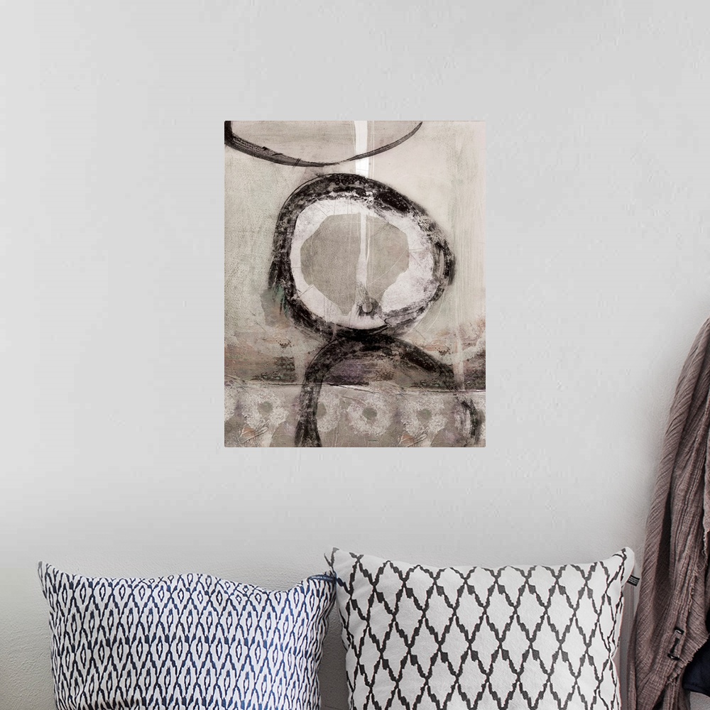 A bohemian room featuring A neutral, contemporary painting in earthy tones and organic, circular shapes