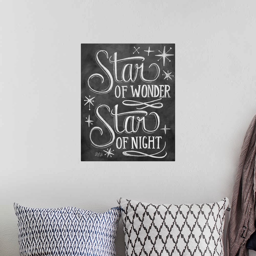 A bohemian room featuring "Star of wonder, star of night" handwritten in chalk on a black background.