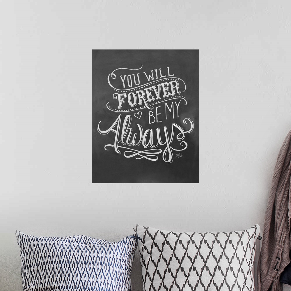 A bohemian room featuring "You will forever be my always" handwritten in white chalk on a black background.