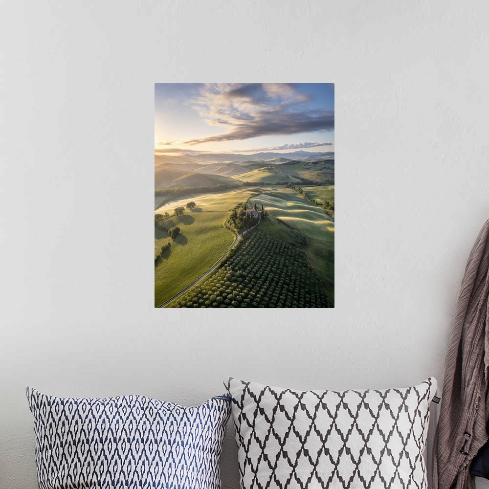 A bohemian room featuring Podere Belvedere and the surrounding countryside at sunrise. San Quirico d'Orcia, Val d'Orcia, Tu...
