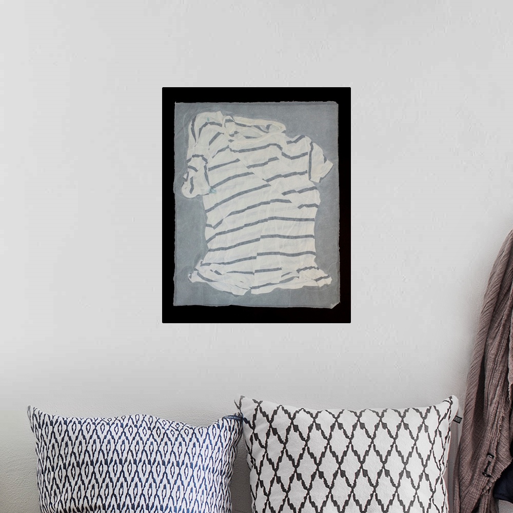 A bohemian room featuring A striped, torn and mended t-shirt suspended in handmade paper.