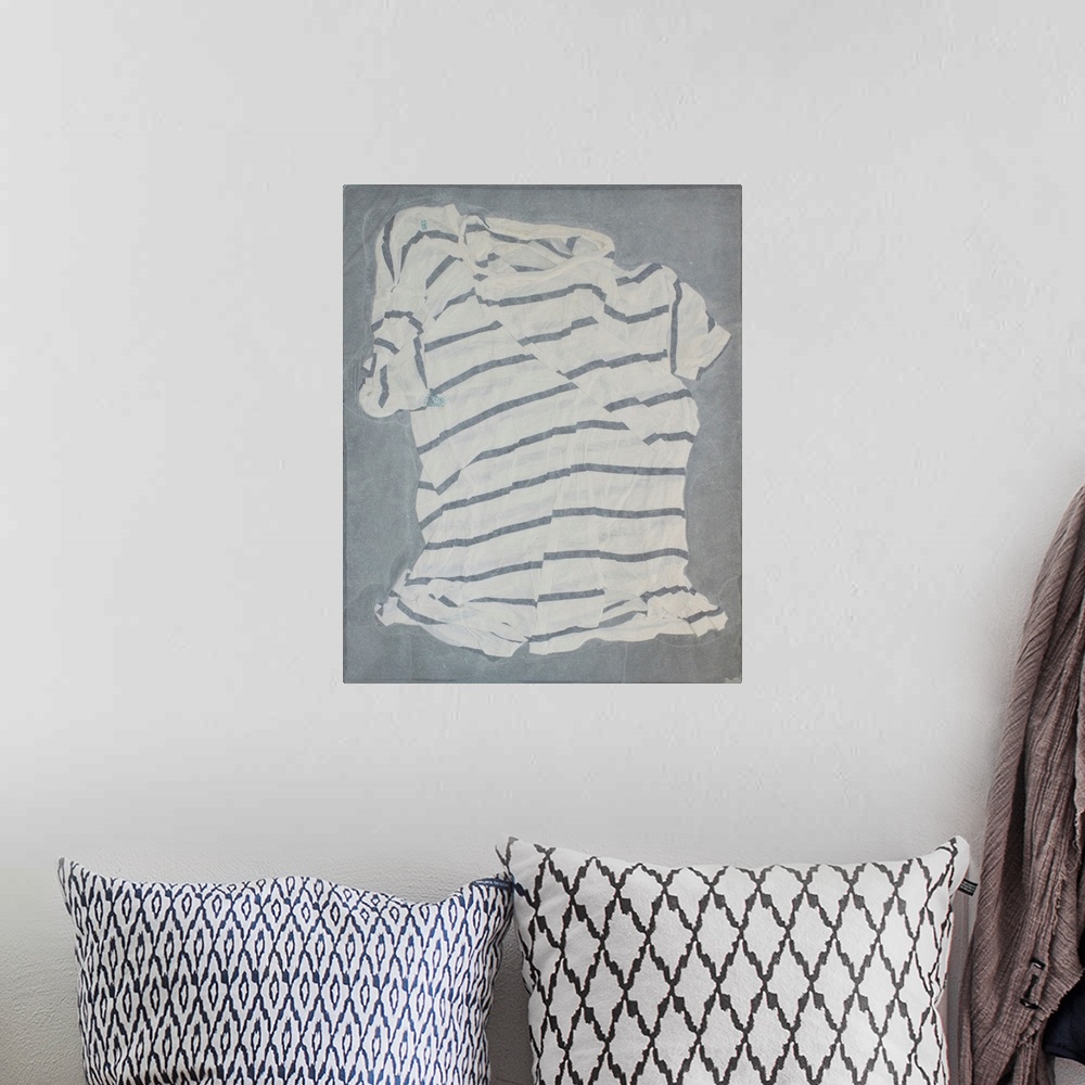 A bohemian room featuring A striped, torn and mended t-shirt suspended in handmade paper.