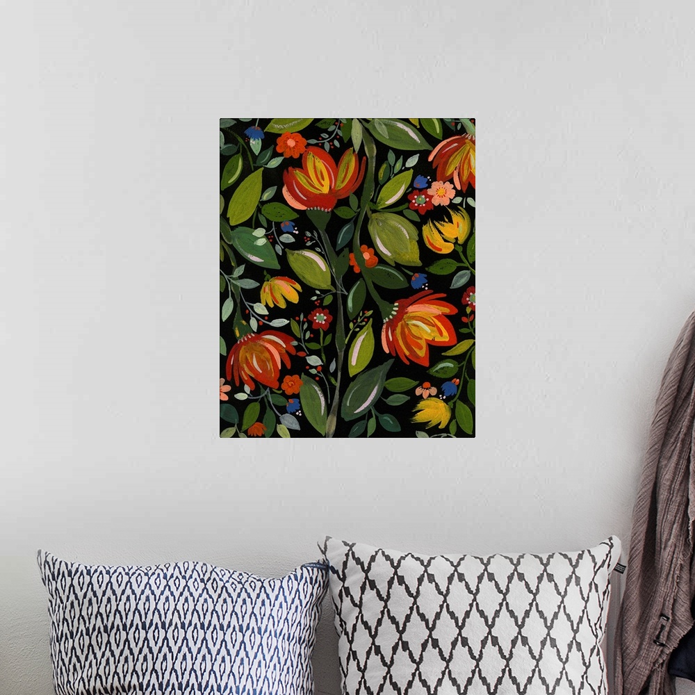A bohemian room featuring Painting of warm-colored flowers and green leaves against a black background
