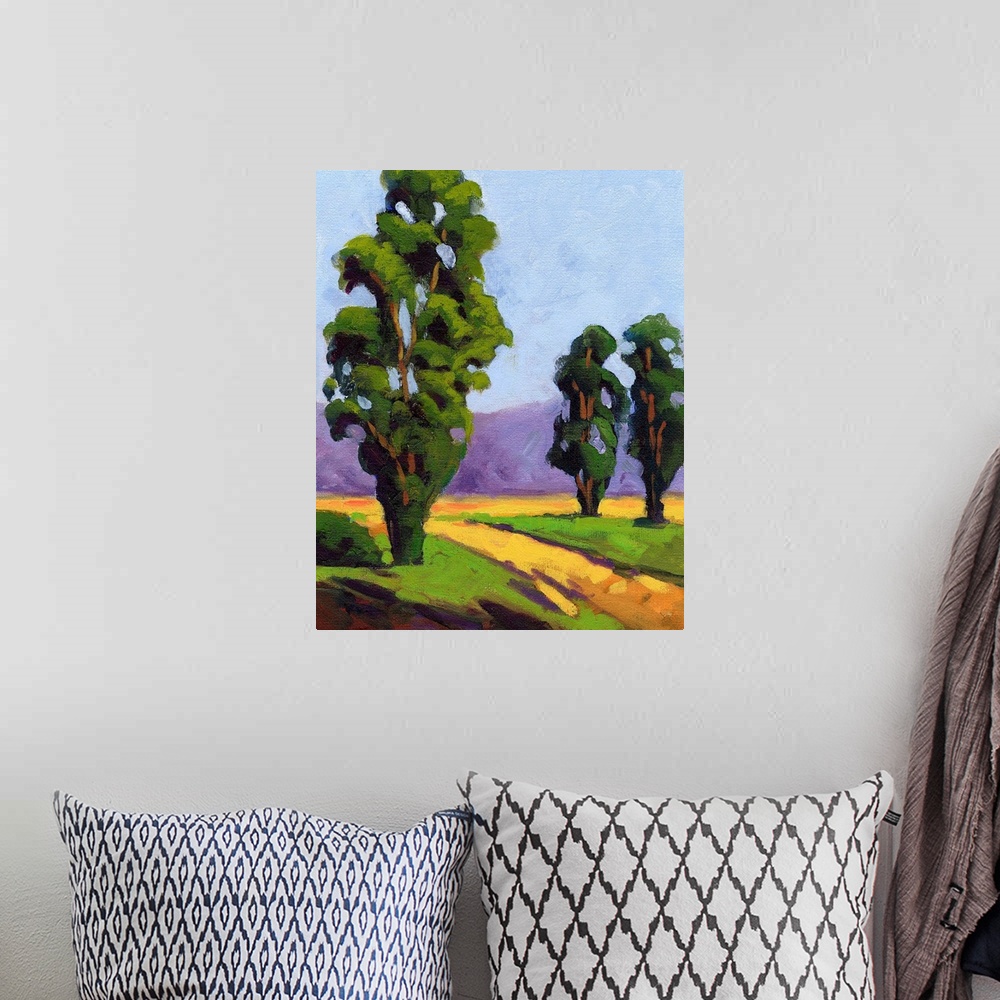 A bohemian room featuring A contemporary painting of a small country road framed by Eucalyptus  trees.