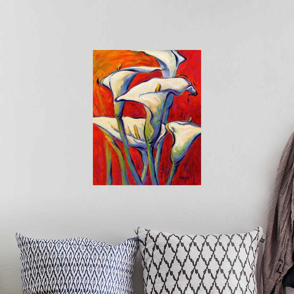 A bohemian room featuring A vertical contemporary painting of a bouquet of white lilies against a red background.