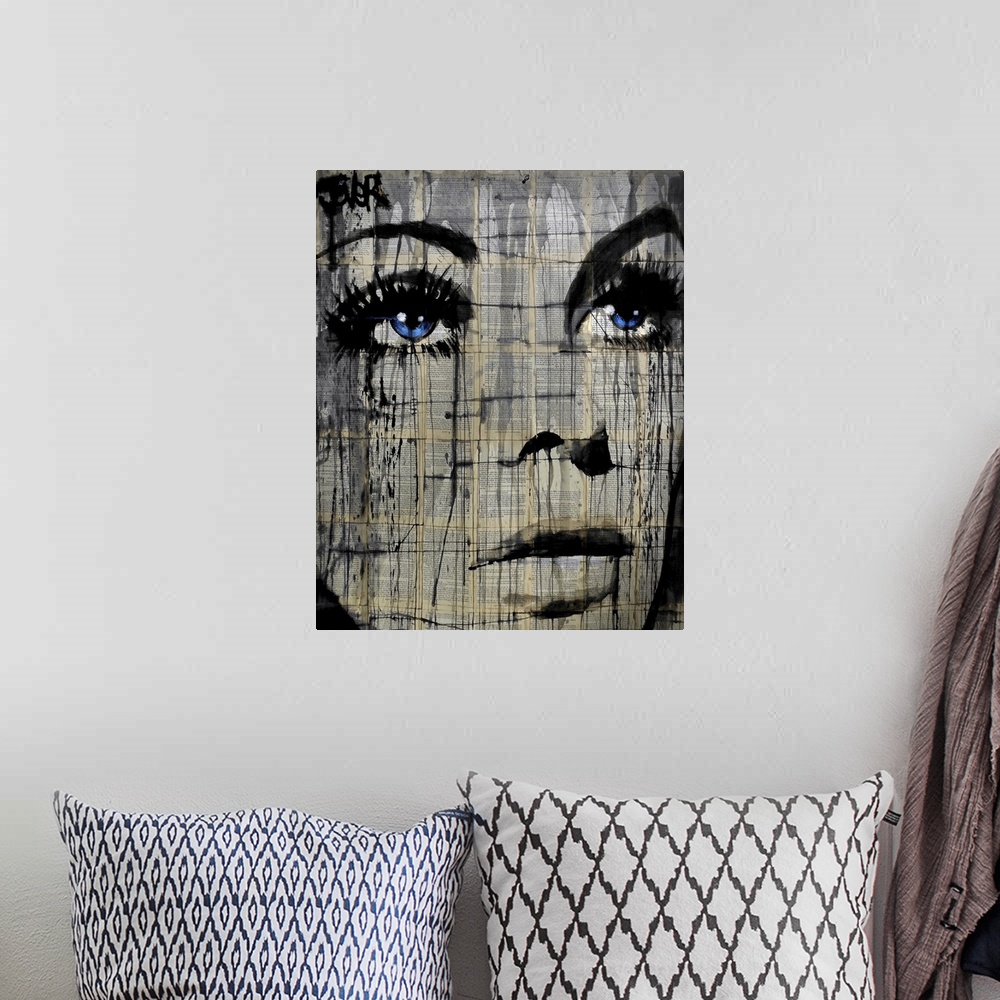 A bohemian room featuring Contemporary artwork of a close-up of a woman's face with deep blue eyes against a background of ...