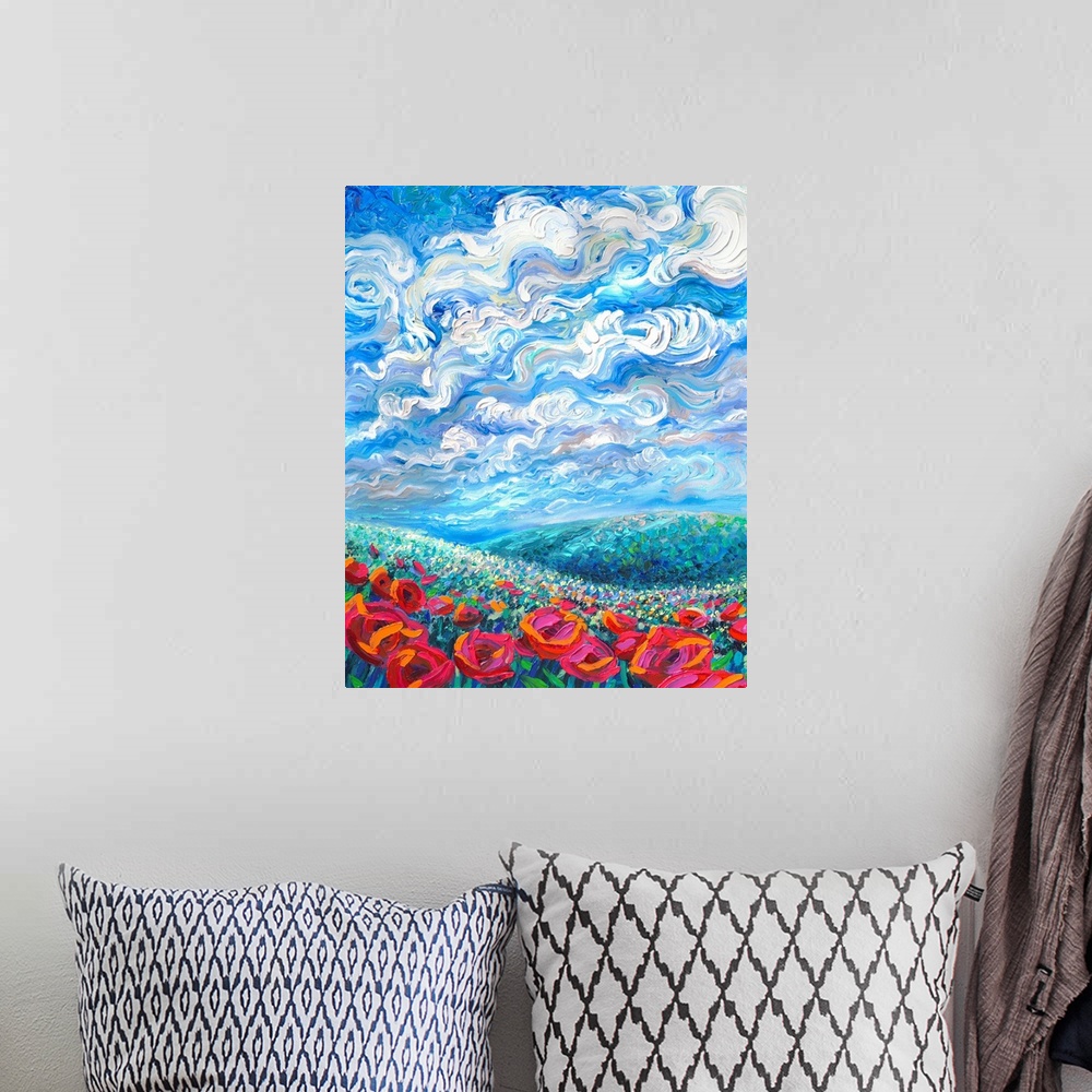 A bohemian room featuring Brightly colored contemporary artwork of a landscape with flowers.