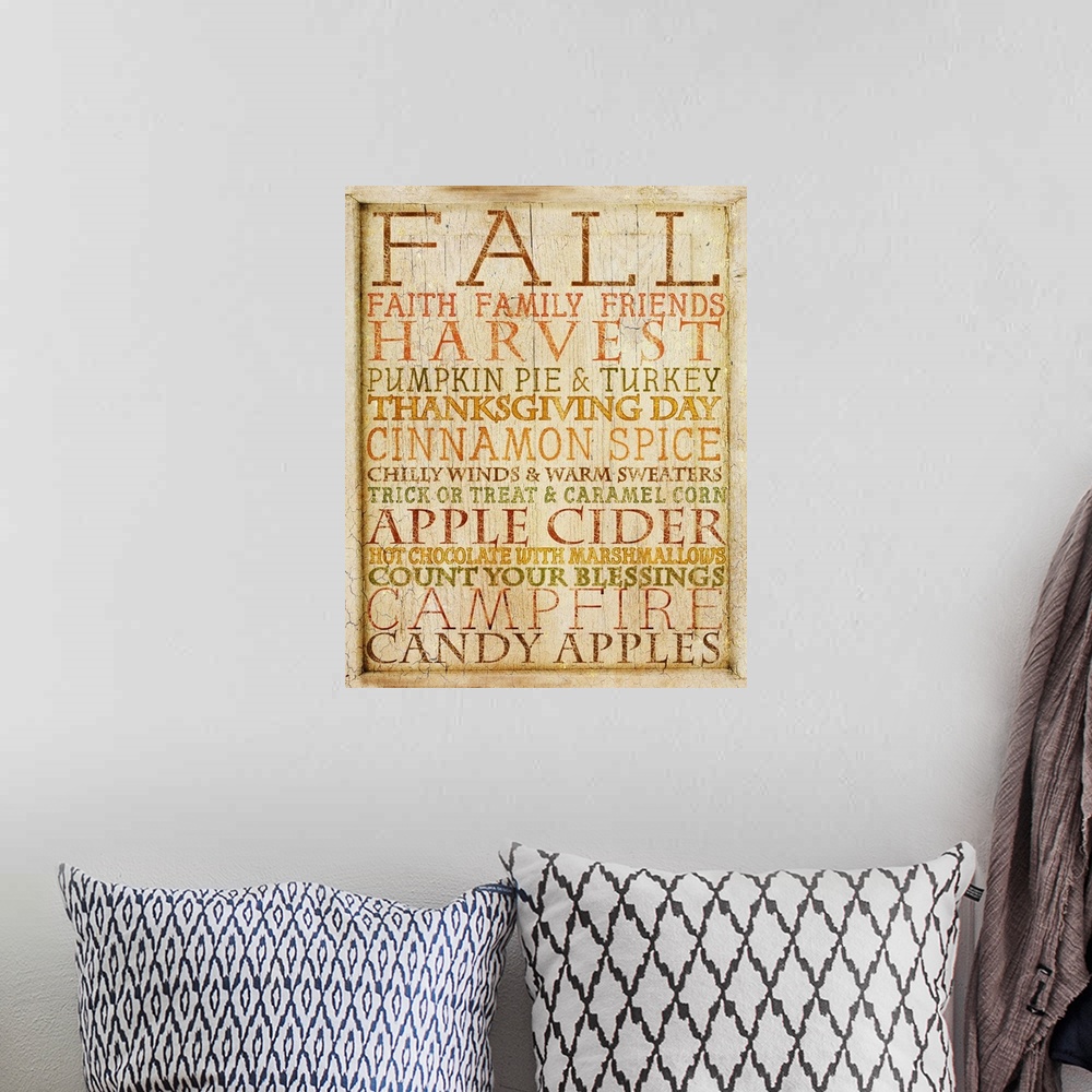 A bohemian room featuring Weathered typography artwork with autumn-themed phrases.