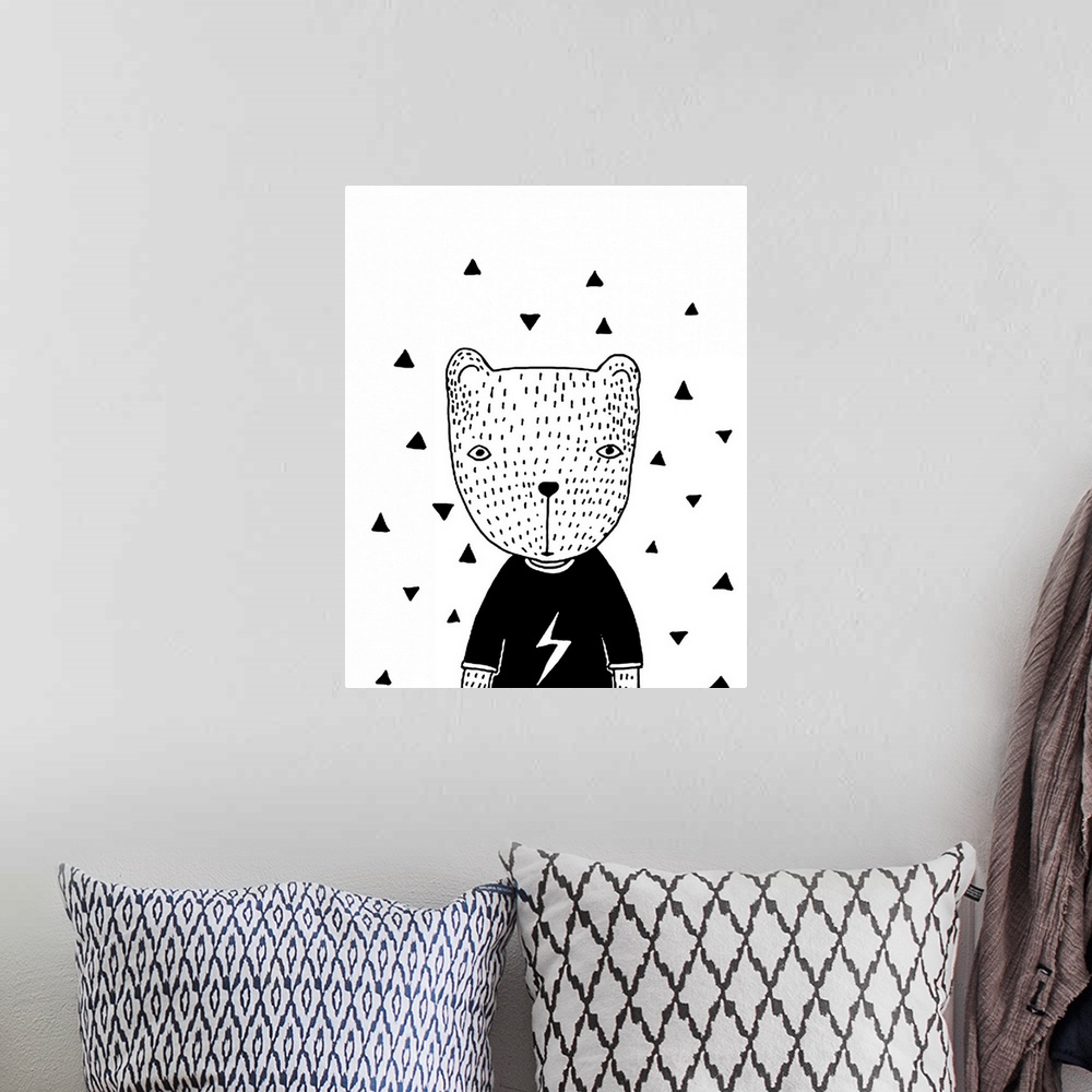 A bohemian room featuring A creative black and white illustration of a bear wearing a sweater with triangle shapes on the w...