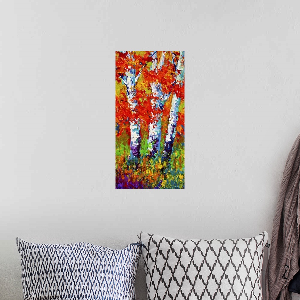 A bohemian room featuring Vertical painting on a big canvas of several birch trees surrounded by vibrant fall leaves and gr...