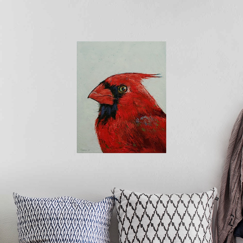 A bohemian room featuring A contemporary painting of close-up portrait of a striking red cardinal.