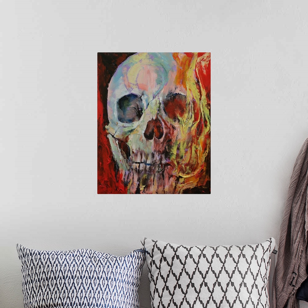 A bohemian room featuring A human skull with fire enveloping half the face.