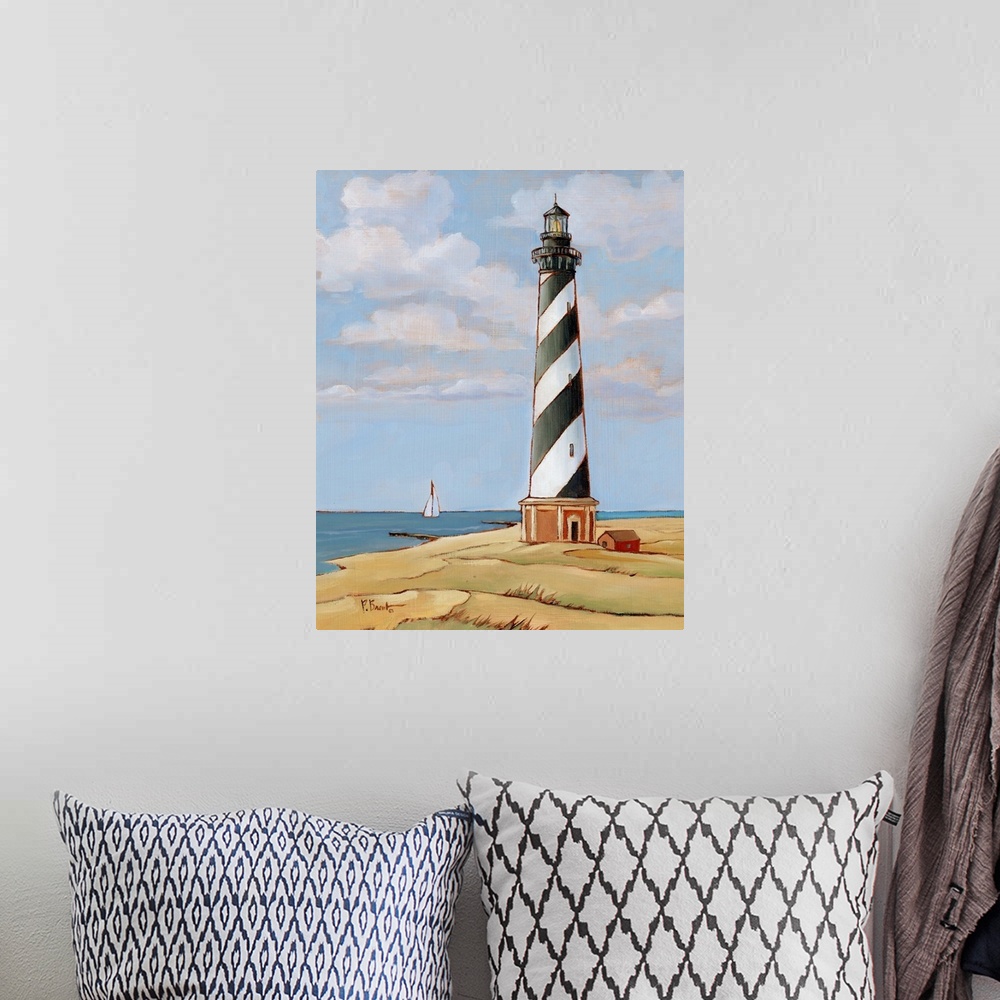 A bohemian room featuring Painting of the striped Cape Hatteras lighthouse on the Outer Banks against a cloudy sky.