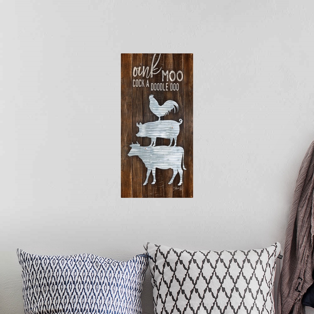 A bohemian room featuring "Oink Moo Cock A Doodle Doo" design against a wood plank wall.