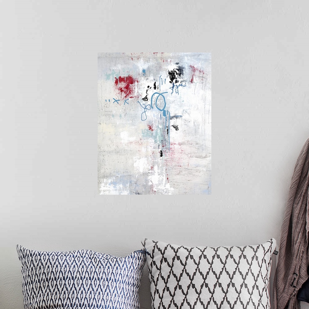A bohemian room featuring Textured abstract painting with blue and red details.