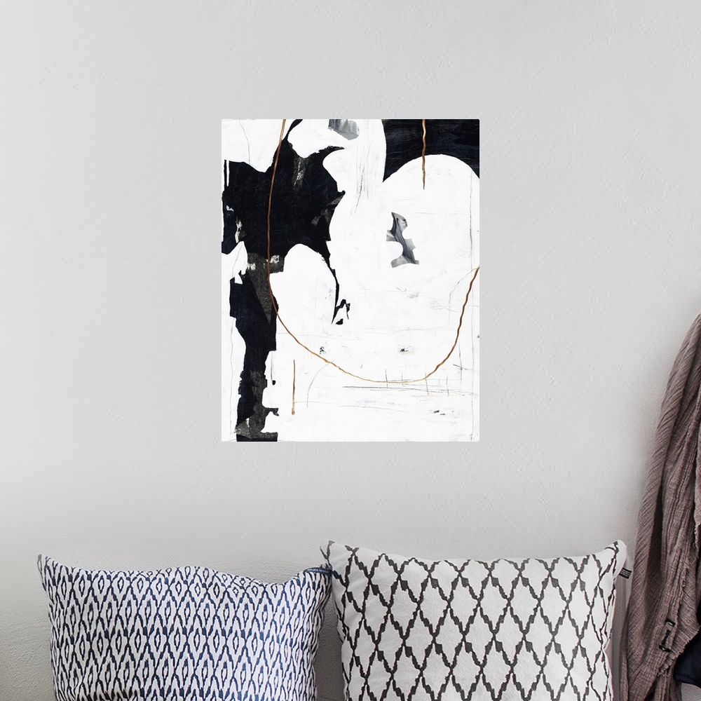 A bohemian room featuring Black and white abstract painting with metallic gold accents.