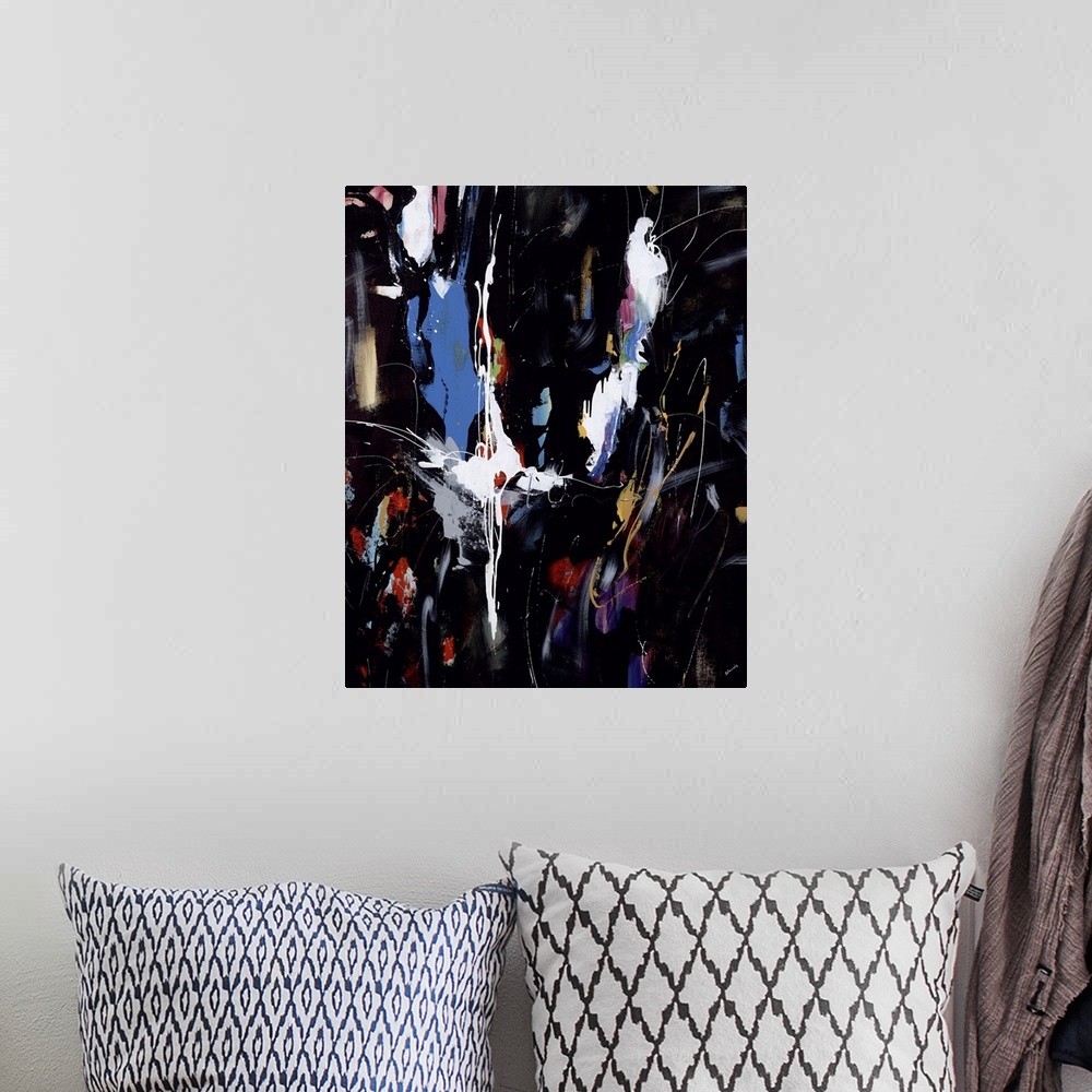 A bohemian room featuring Abstract painting of vibrant colors against a black background.