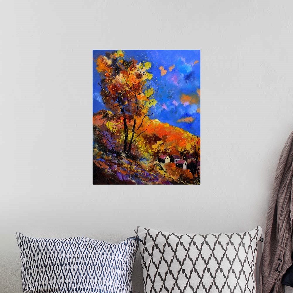 A bohemian room featuring Vibrant painting of an autumn day with blossoming trees, a colorful sky, and a village in the dis...