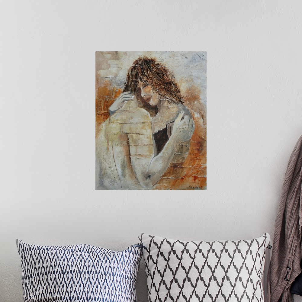 A bohemian room featuring A portrait of a couple embracing done in textured, neutral colors.