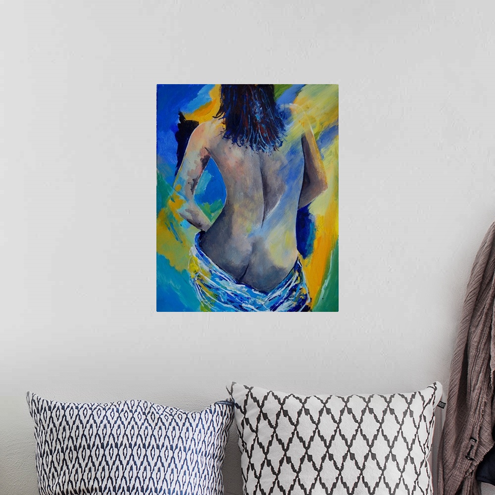 A bohemian room featuring A nude painting of the back of a woman draped in a white cloth in textured colors of blue and yel...