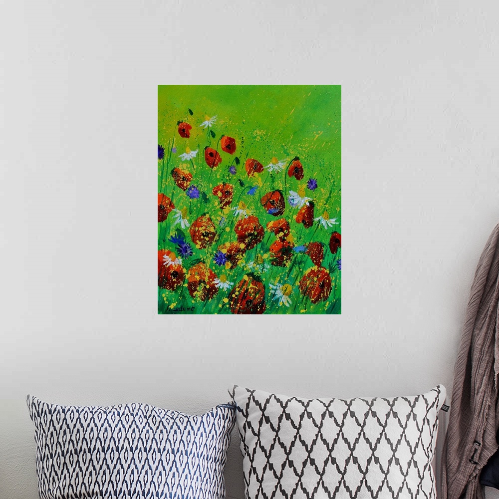 A bohemian room featuring Vertical painting of colorful flowers in a field with small speckles of paint overlapping.