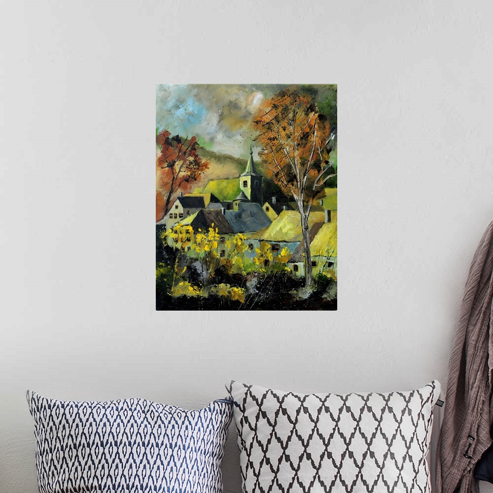 A bohemian room featuring Vertical painting of a darkened landscape with trees in the foreground and a Belgium village in t...