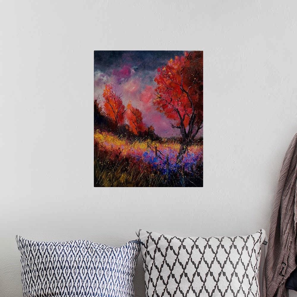 A bohemian room featuring Vertical painting of a field with red leaved trees and splatters of multi-color paint overlapping...
