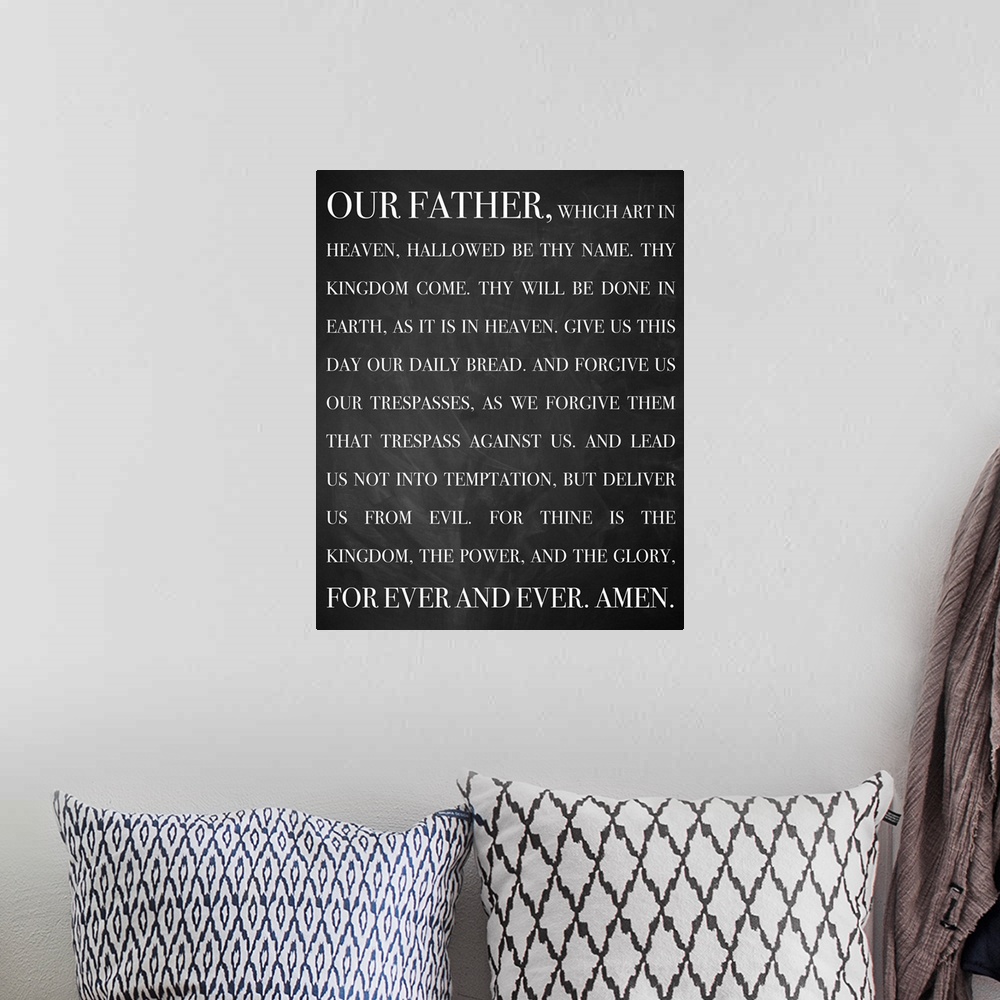 A bohemian room featuring A bold, monochromatic typographical image that displays the words of the Lord's Prayer in white l...