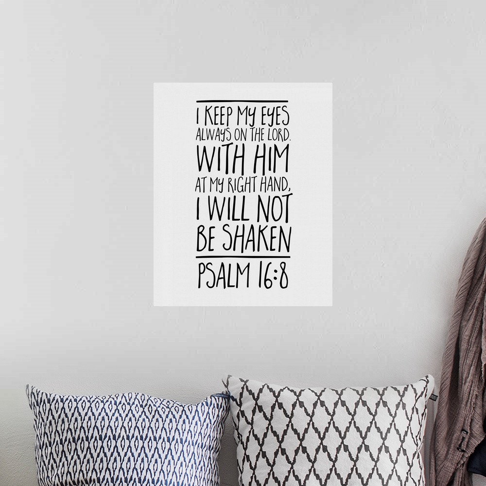 A bohemian room featuring Handlettered Bible verse reading She laughs without fear of the future.