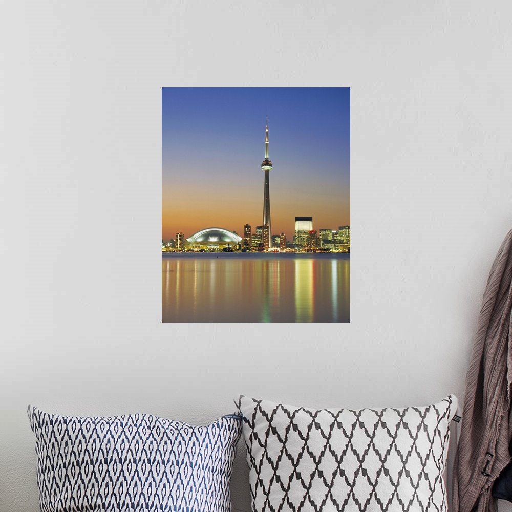 A bohemian room featuring City skyline including CN Tower in the evening, Toronto, Ontario, Canada