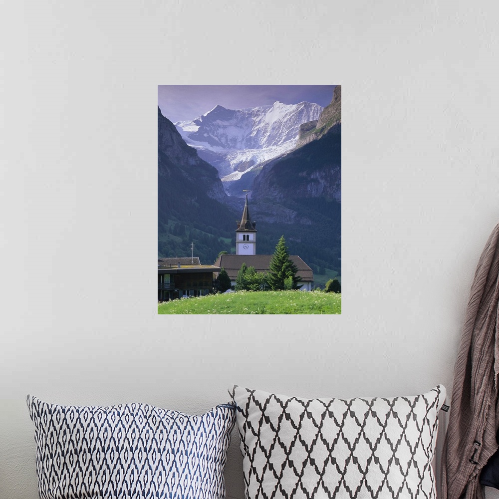 A bohemian room featuring Village church and Oberer Grindelwald Glacier, Swiss Alps, Switzerland
