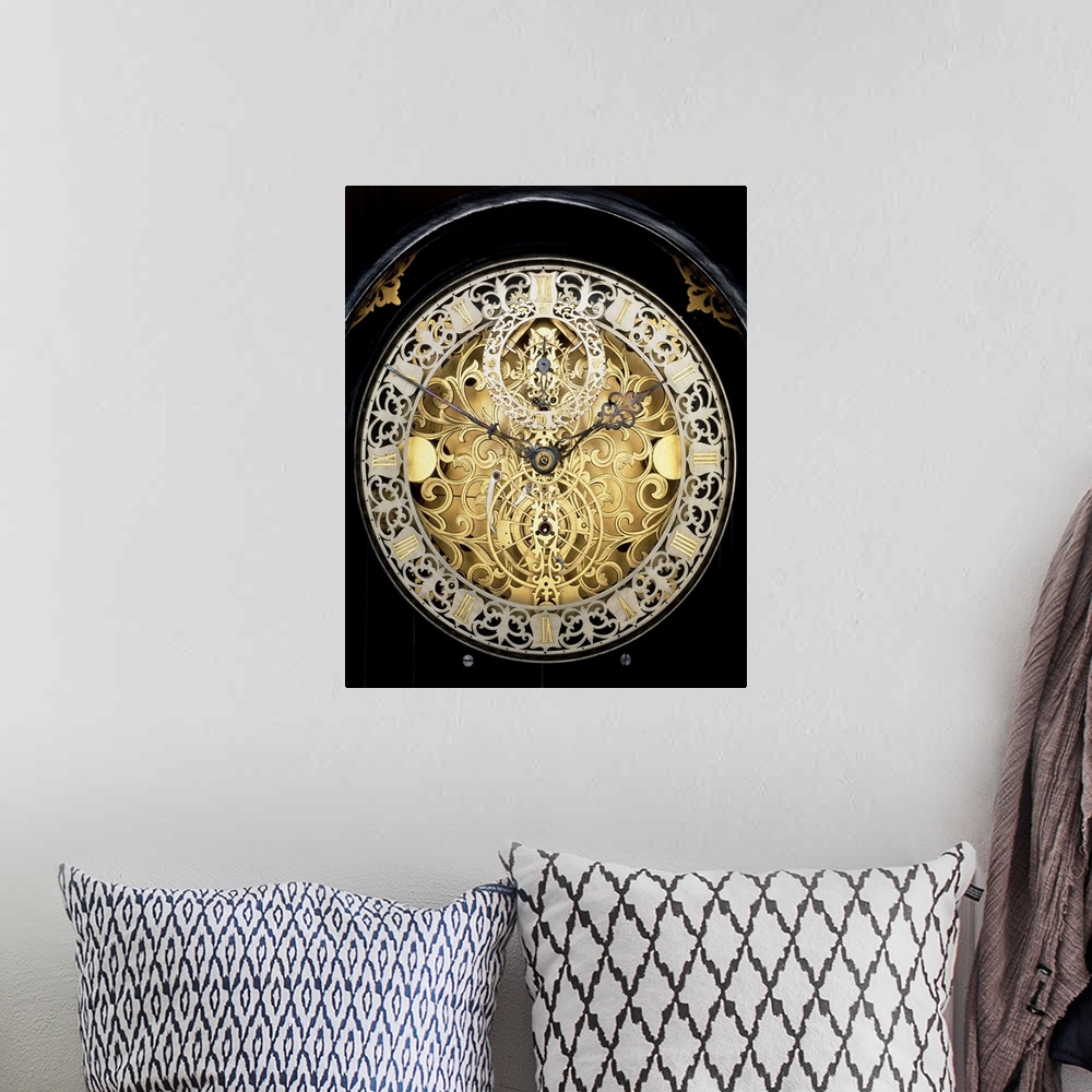 A bohemian room featuring Antique clock. Face of an antique skeleton clock, revealing the internal gearing. The main face s...