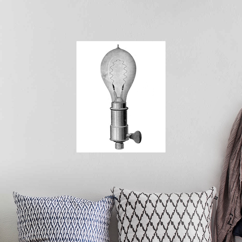 A bohemian room featuring Light bulb, historical artwork. This is an incandescent light bulb, using a metal filament throug...
